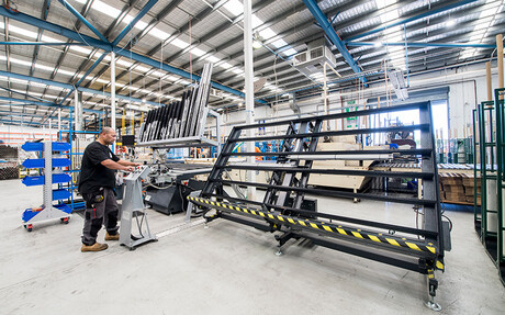 Compressed air is essential to the manufacturing process, here used to power the hinge window frame and sash assembly table.