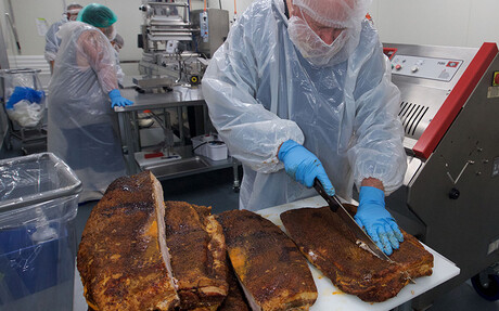 Preparing the smoked meat at Texas BBQ Foods